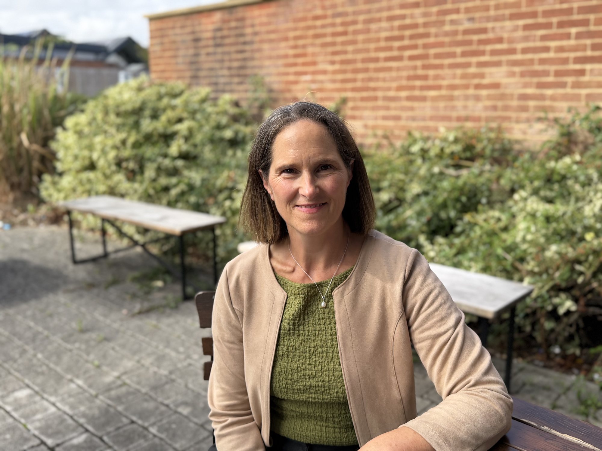 Kathleen Cornmell, Registered Nutritionist, sitting outdoors in Basingstoke